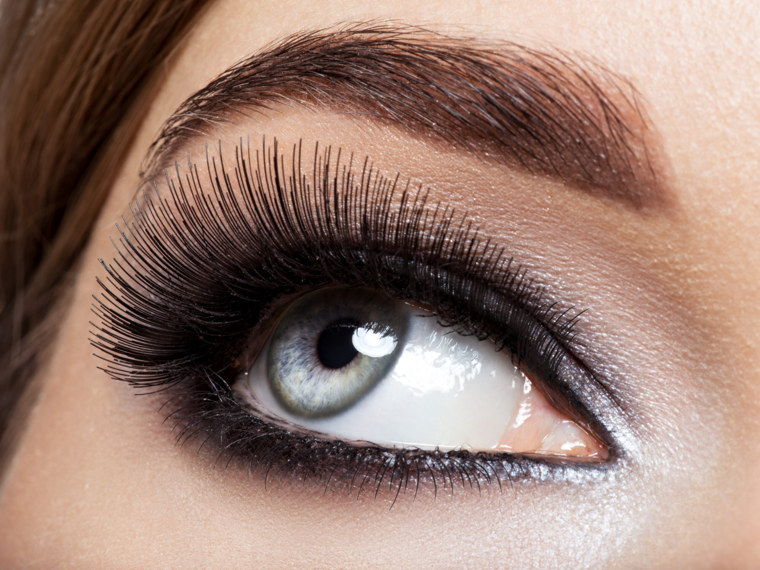 woman's eye with black eye makeup. Macro style image