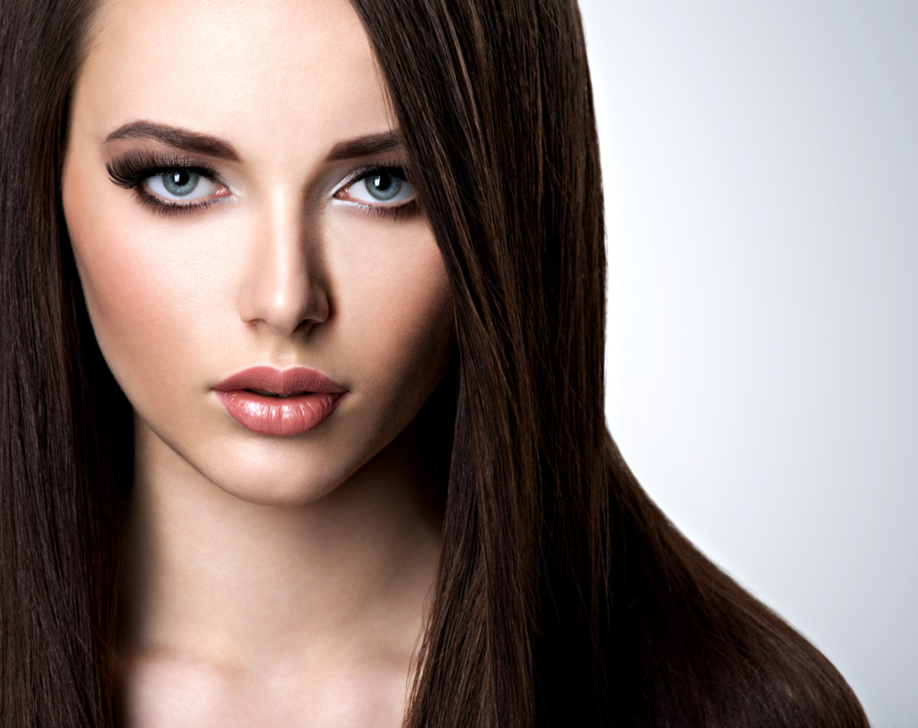 Portrait of beautiful woman with long straight brown hair